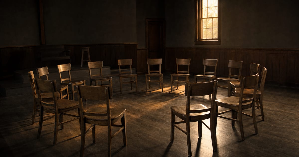 An empty circle of wooden chairs in a church fellowship room, representing a church's restoration team preparing to respond to a pastor's pornography confession