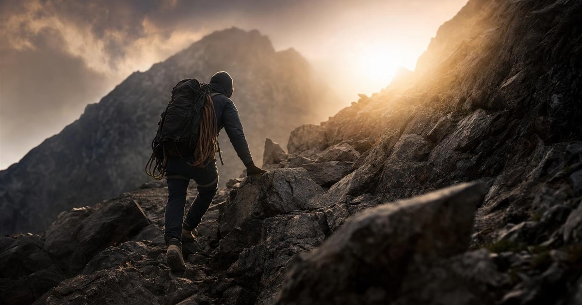 Climber encountering rough, unexpected terrain mid-route, representing real obstacles in the process
